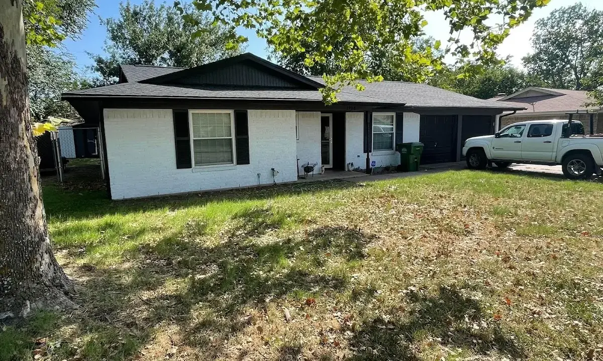 Professional roofing crew working on a residential roof in Oceano